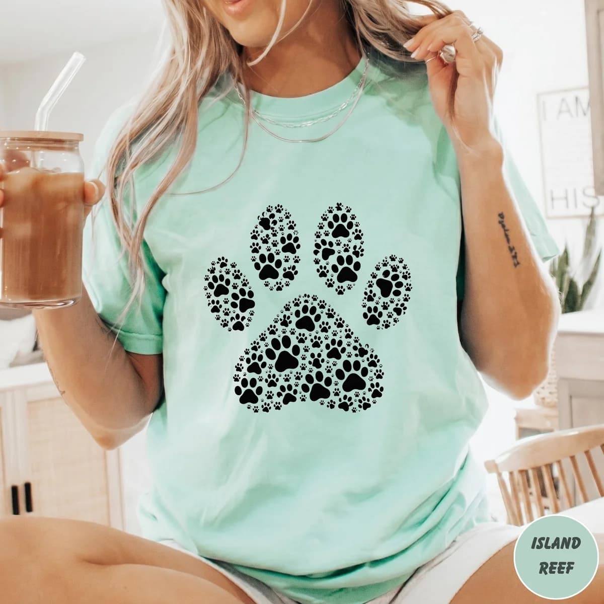 Mint tee with a spotted paw print design